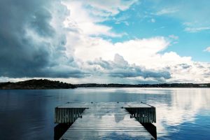 still lake blue sky white clouds