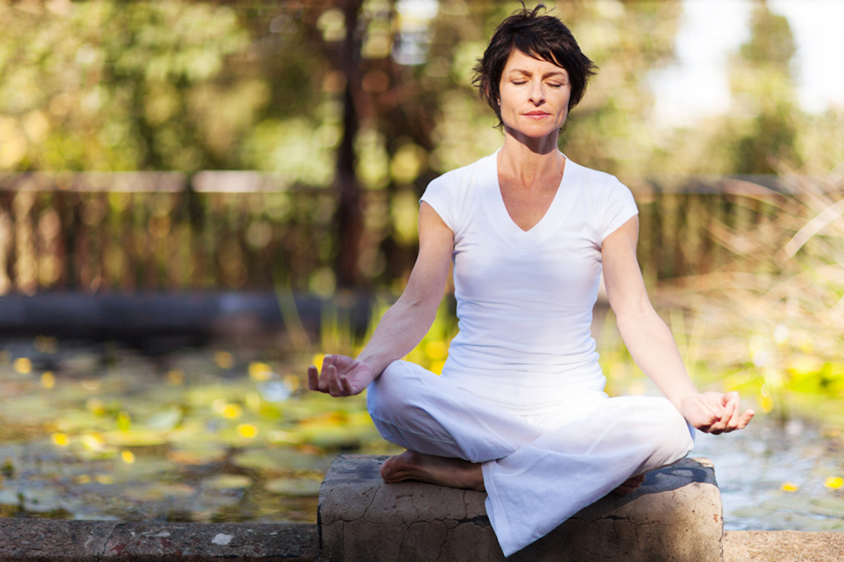 middle aged woman yoga meditation