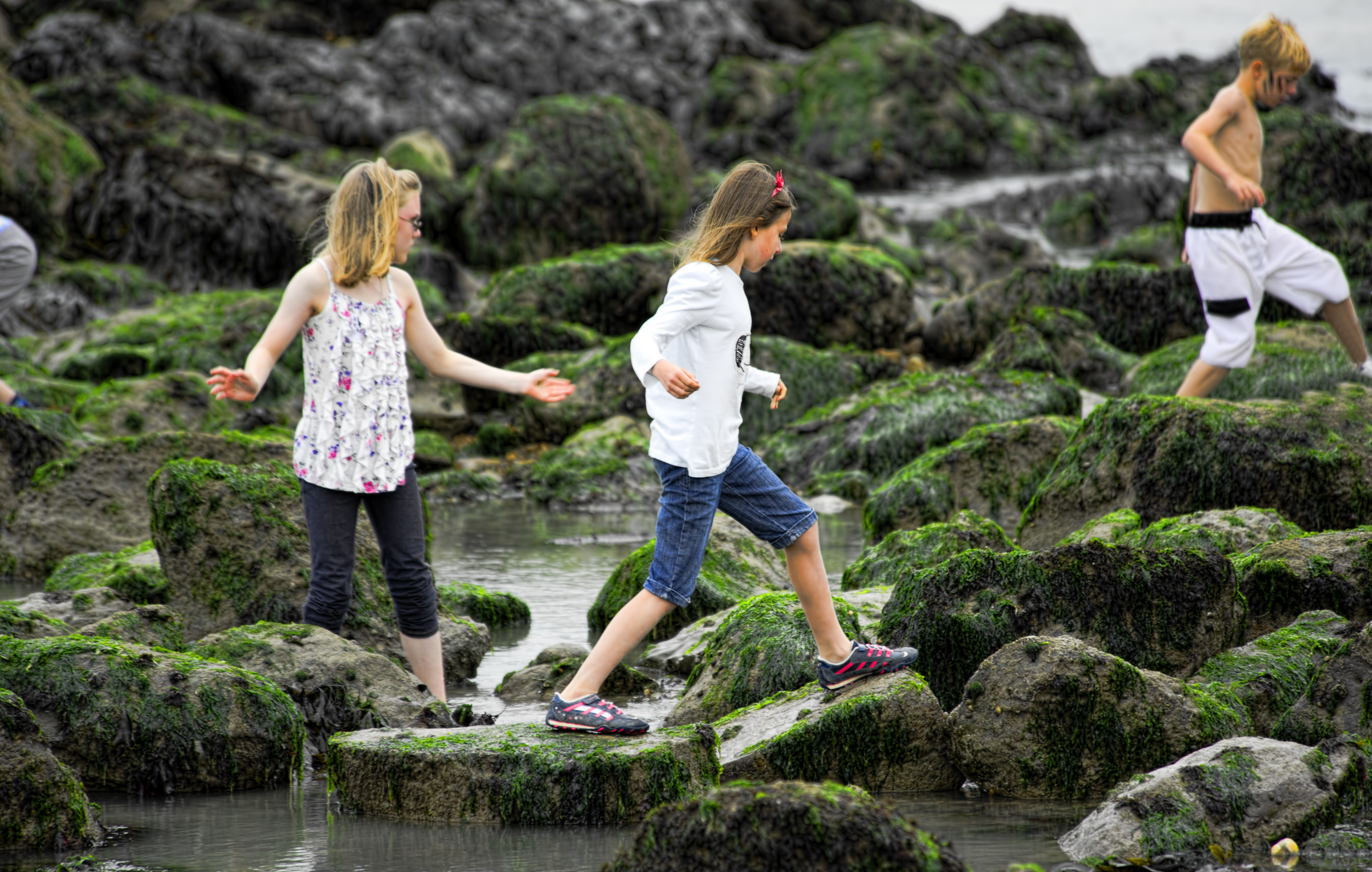 children climbing over the rocks